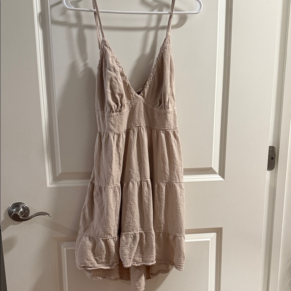 Beige open backed linen style dress